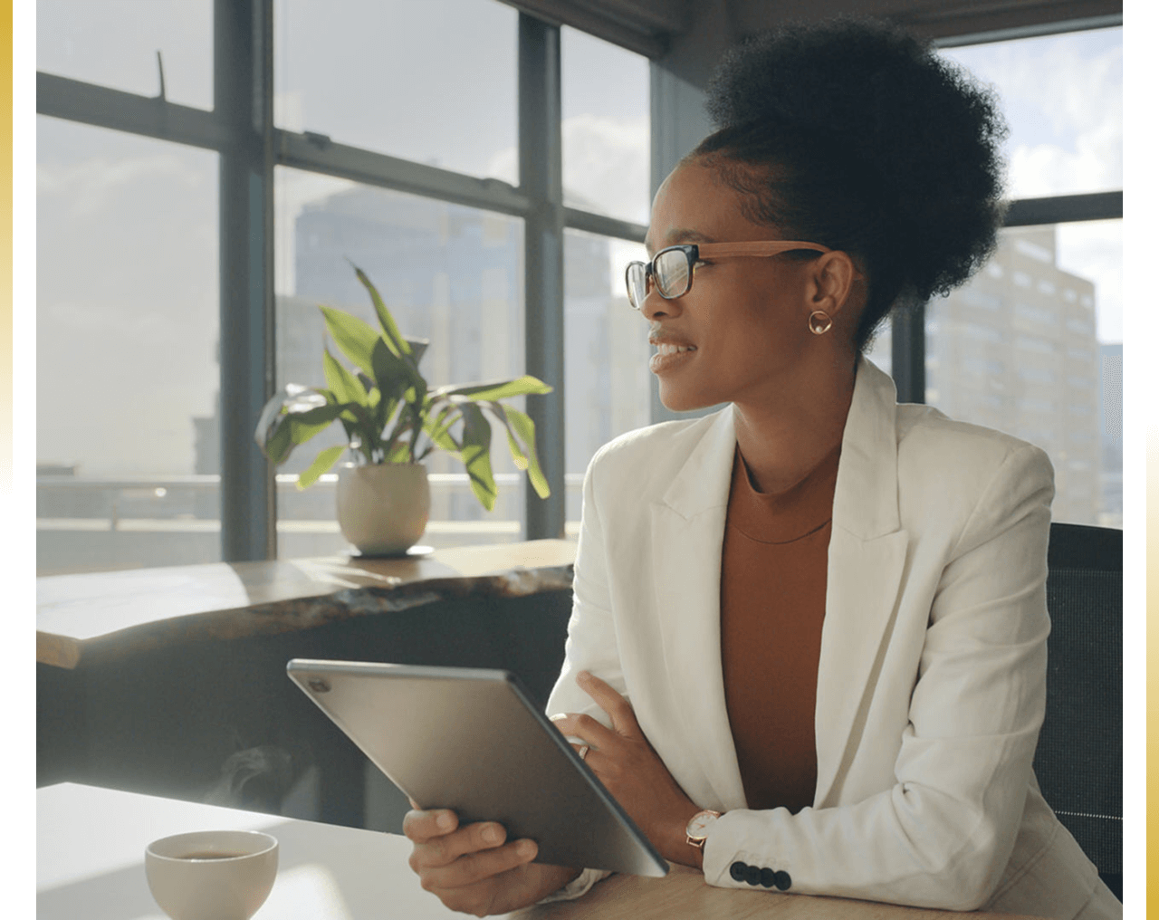 Businesswoman with tablet in modern office.